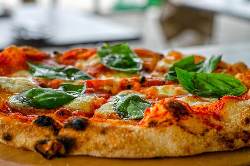 Classic Margherita punch pizza with fresh tomato and basil